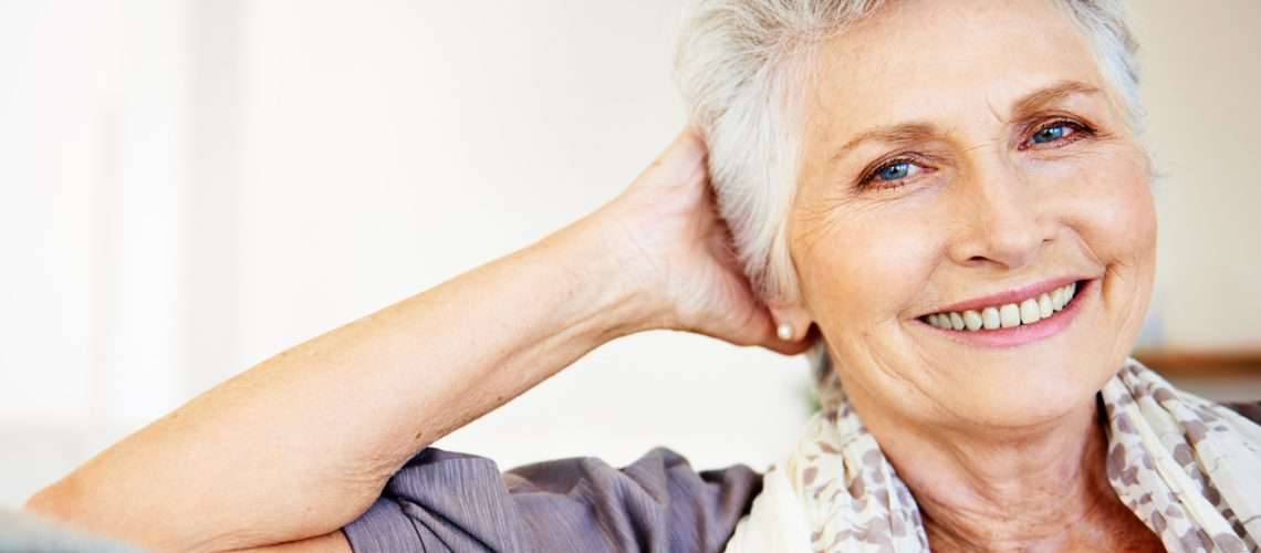 Smiling senior woman relaxing at home